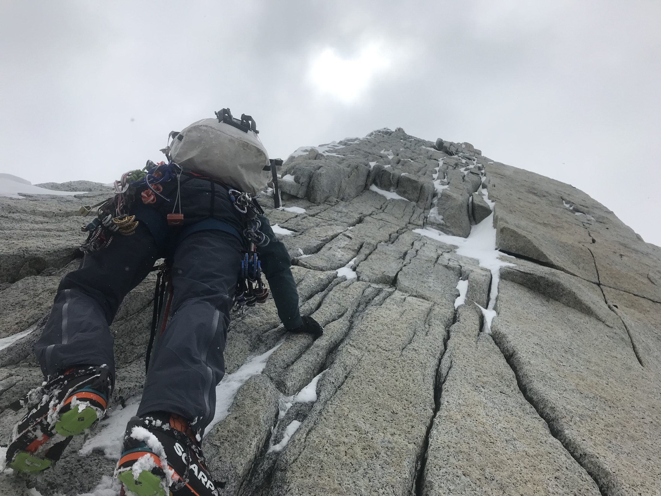 Mike Finkowski carrying climbing equipment in Patagonia
