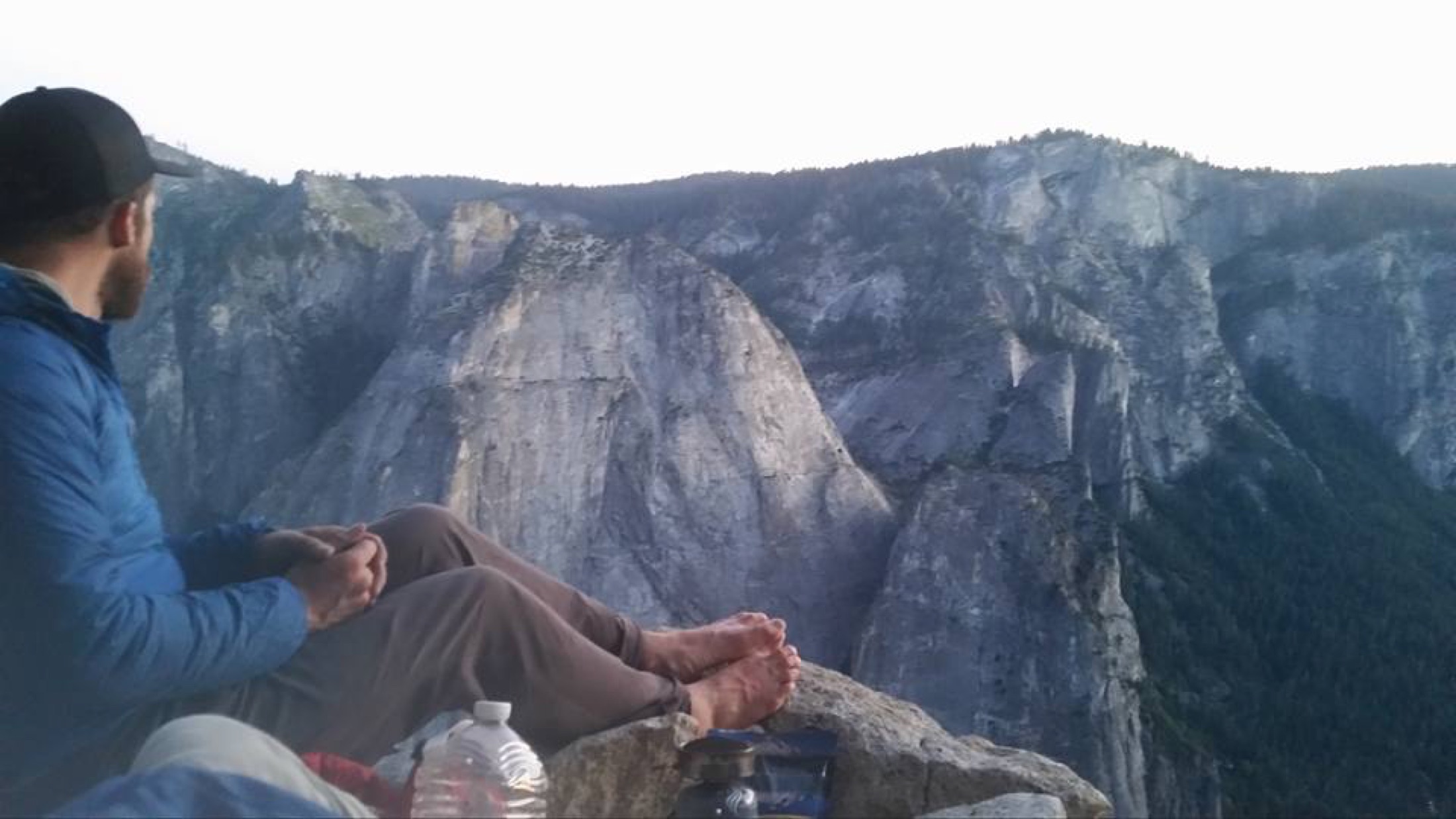 Climber ascending a steep granite big wall